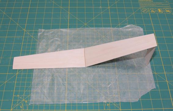 Check the dihedral angle with a piece of scrap wood 3 3/4” long. When they fit perfectly, glue the wings together.