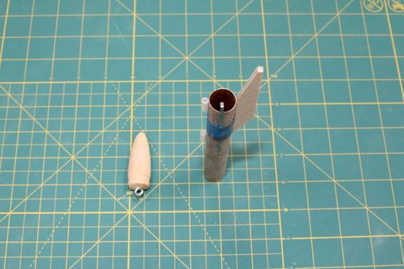 Glue the engine hook, main pylon, launch lugs, and screw eye in place.