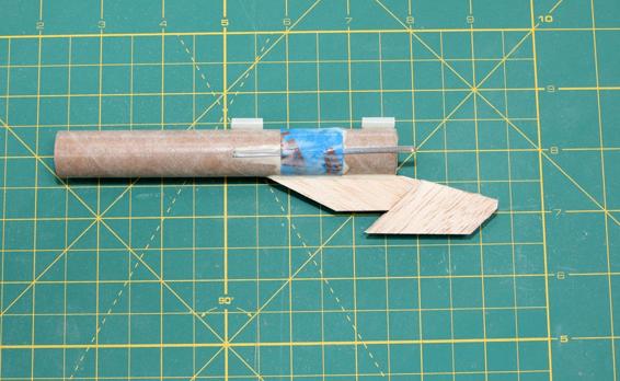 Test the fit, making sure the glider does not wobble but can shake loose easily, then glue the final side wall in place.