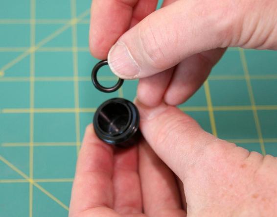 Install the small, fat O-ring in the forward closure.