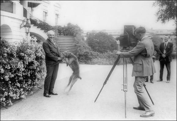 Photo depicts Warren G. Harding, twenty-ninth president of the United States, and his dog Laddie.