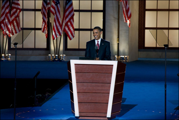 Photo depicts the presidential candidate Obama delivering his nomination acceptance speech in Denver, Colorado.