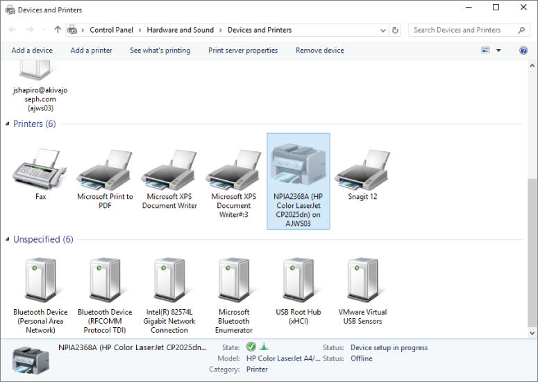 Screenshot of Devices and Printers of Control Panel displaying six printers (one is selected) and six unspecified devices displayed in icons. Information about the selected printer is displayed at the bottom.