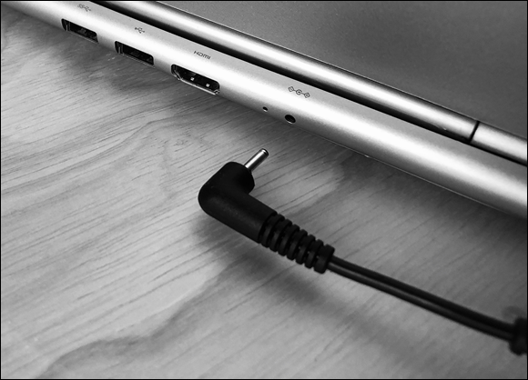 Photo depicts a metal tip style power adaptor.