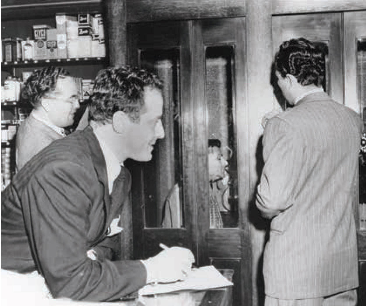 Sidney Skolsky in his telephone booth “office,” 1948.