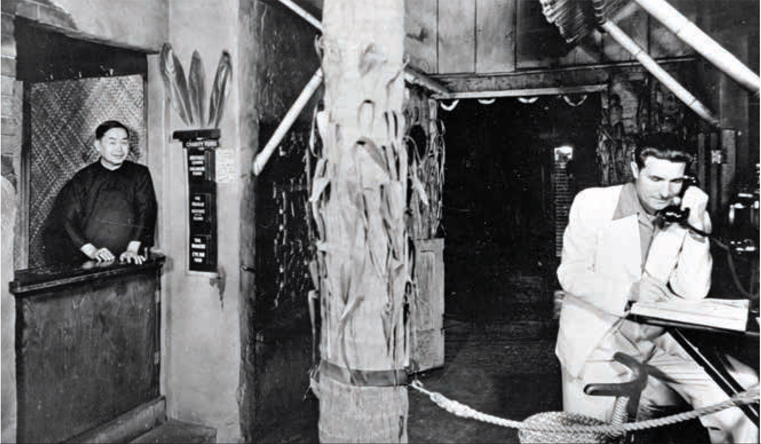 Donn Beach taking a call at the restaurant, 1947.