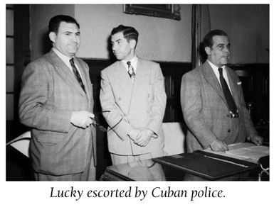 Lucky escorted by Cuban police.