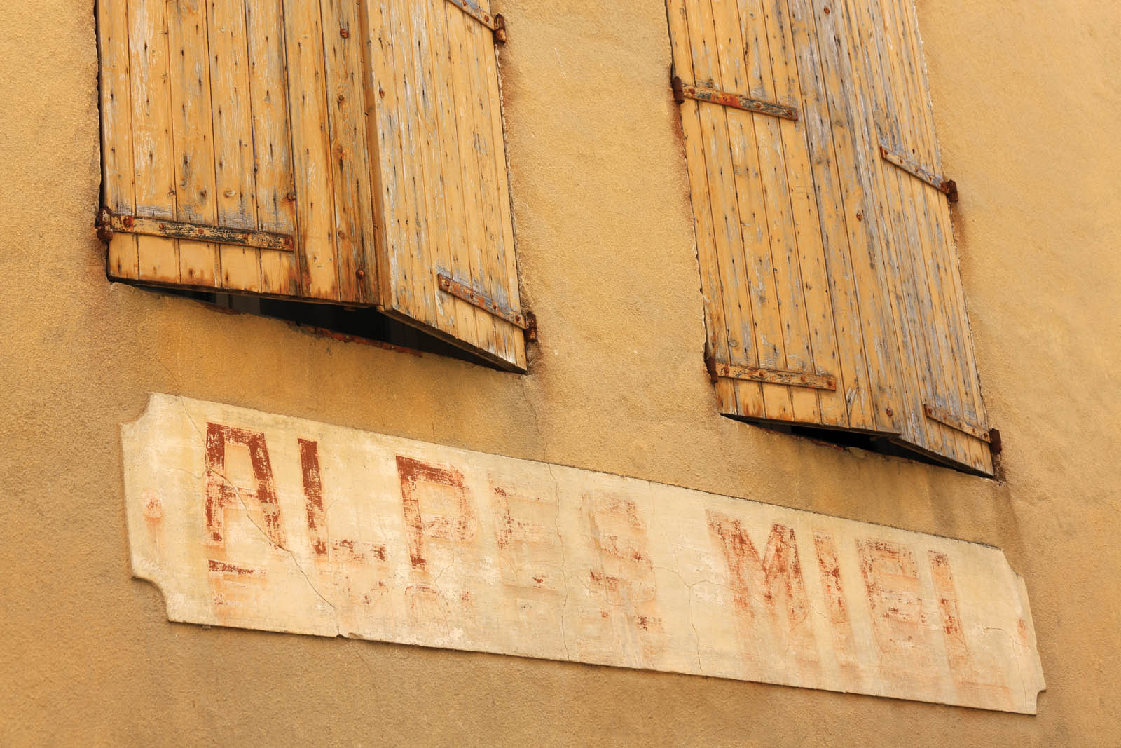 Photo of shuttered windows.