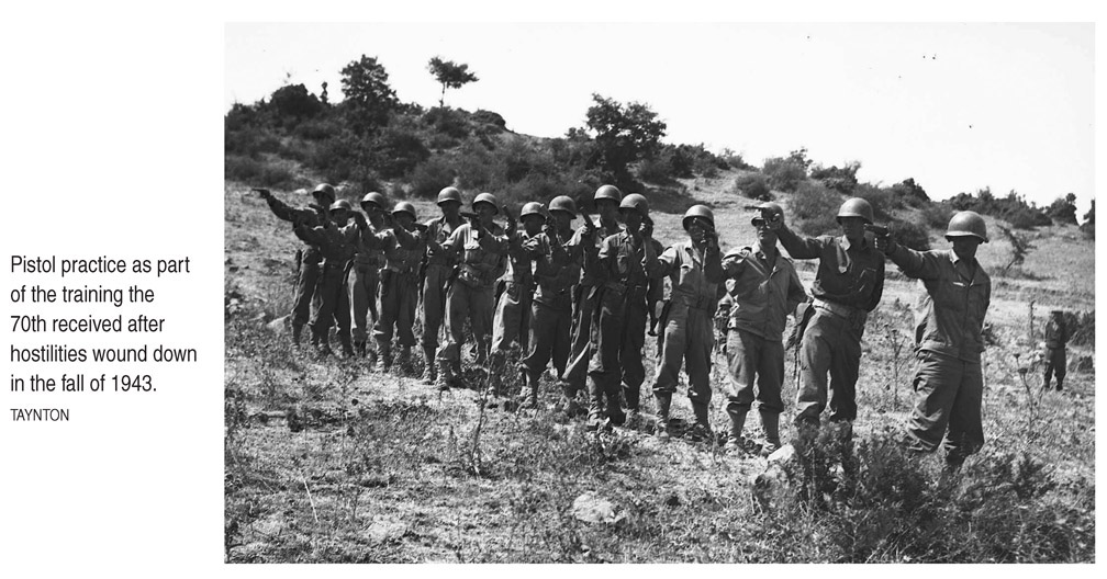 Pistol practice as part of the training the 70th received after hostilities wound down in the fall of 1943. TAYNTON