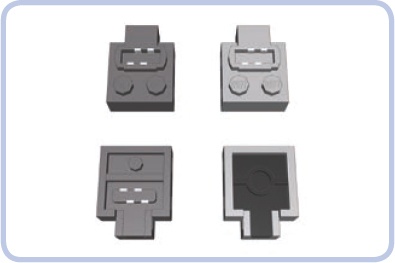 Top and bottom view of a regular Power Functions plug (left) and the adapter plug (right). Each extension wire comes with one plug of each type.