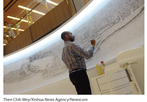 A photo of Stephen Wiltshire drawing on a wall.