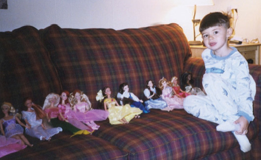 Wyatt at age four, with Barbie dolls, May 2002.