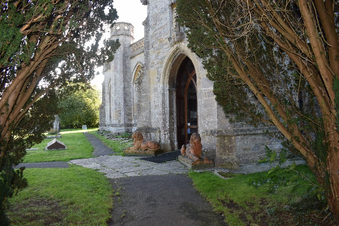 A stone building that has grass and trees Description automatically generated