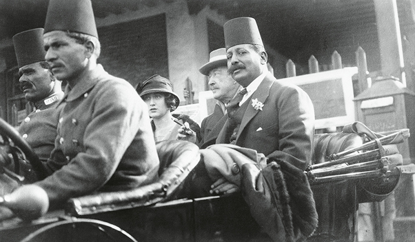 George Herbert, 5th Earl of Carnarvon (1866 - 1923, second from right) riding in a car with his daughter Lady Evelyn Herbert (1901 - 1980) in Luxor, Egypt, 1922. Carnarvon was the financial backer of Howard Carter's excavation of the tomb of Tutankhamun, which took place that year. (Photo by General Photographic Agency/Hulton Archive/Getty Images)