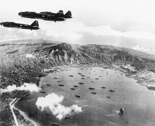 Photo. 7-2. Mitsubishi G4M bombers of the Misawa Air Group over Rabaul Harbor, 28 September 1942