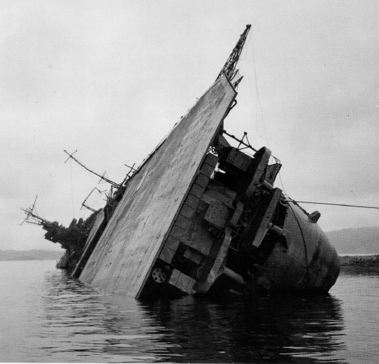 Photo. 7-3. The carrier Amagi capsized in Kure Harbor, 8 October 1945