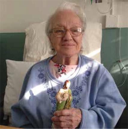 My mom, Blanche, with her beloved St. Jude Statue, 2016. (Author Collection)