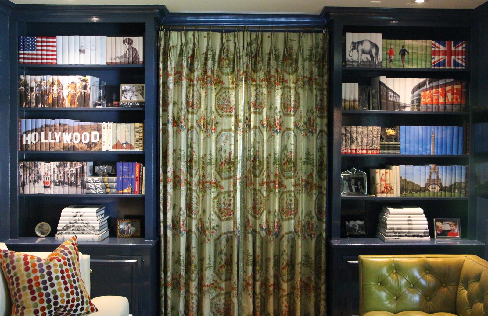 Photo of a pair of shelves with groups of books showing custom jacket images.