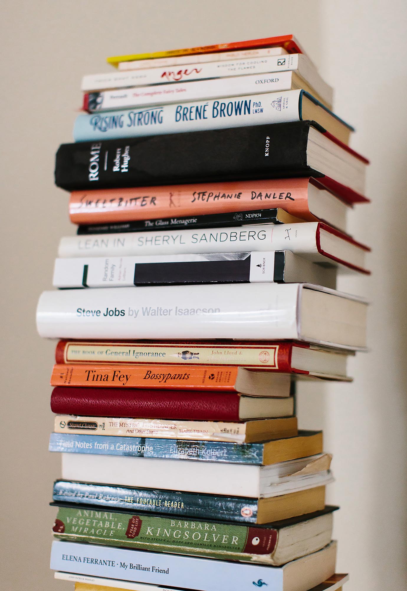 Photo of a tall stack of books.