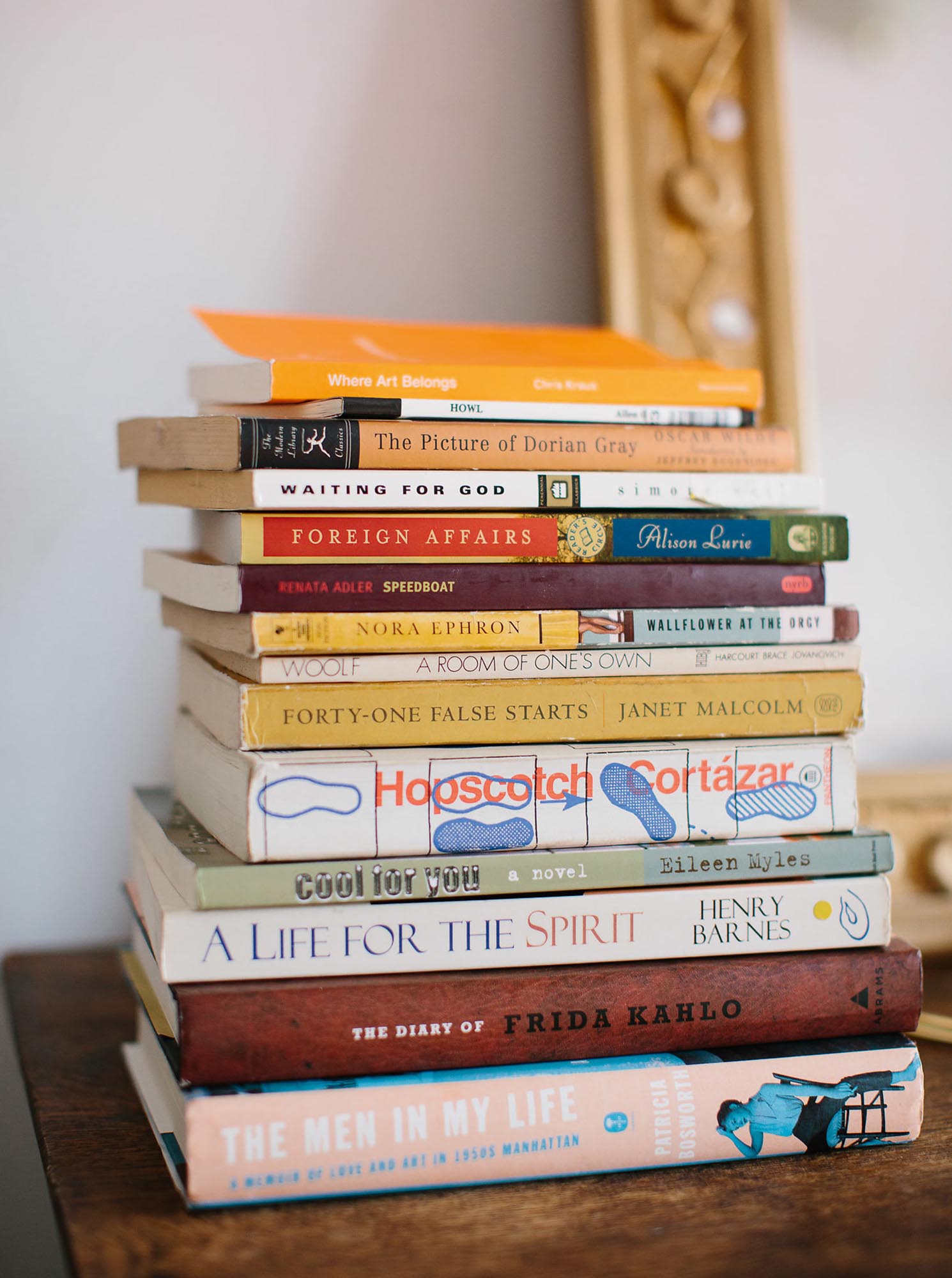 Photo of a stack of aged, worn books.