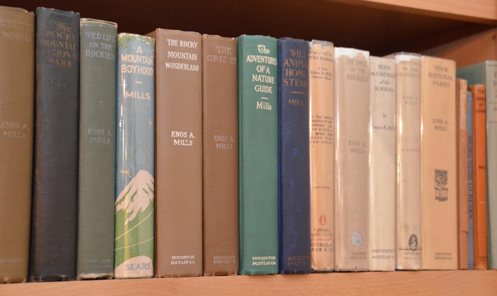 Photo of Thatcher's collection of books by Enos Mills.