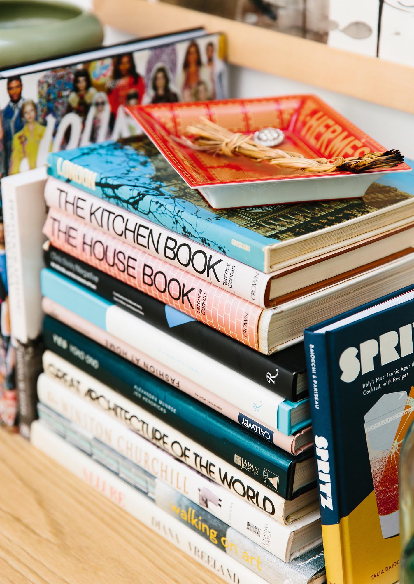 Photo of a stack of books featuring architecture titles.