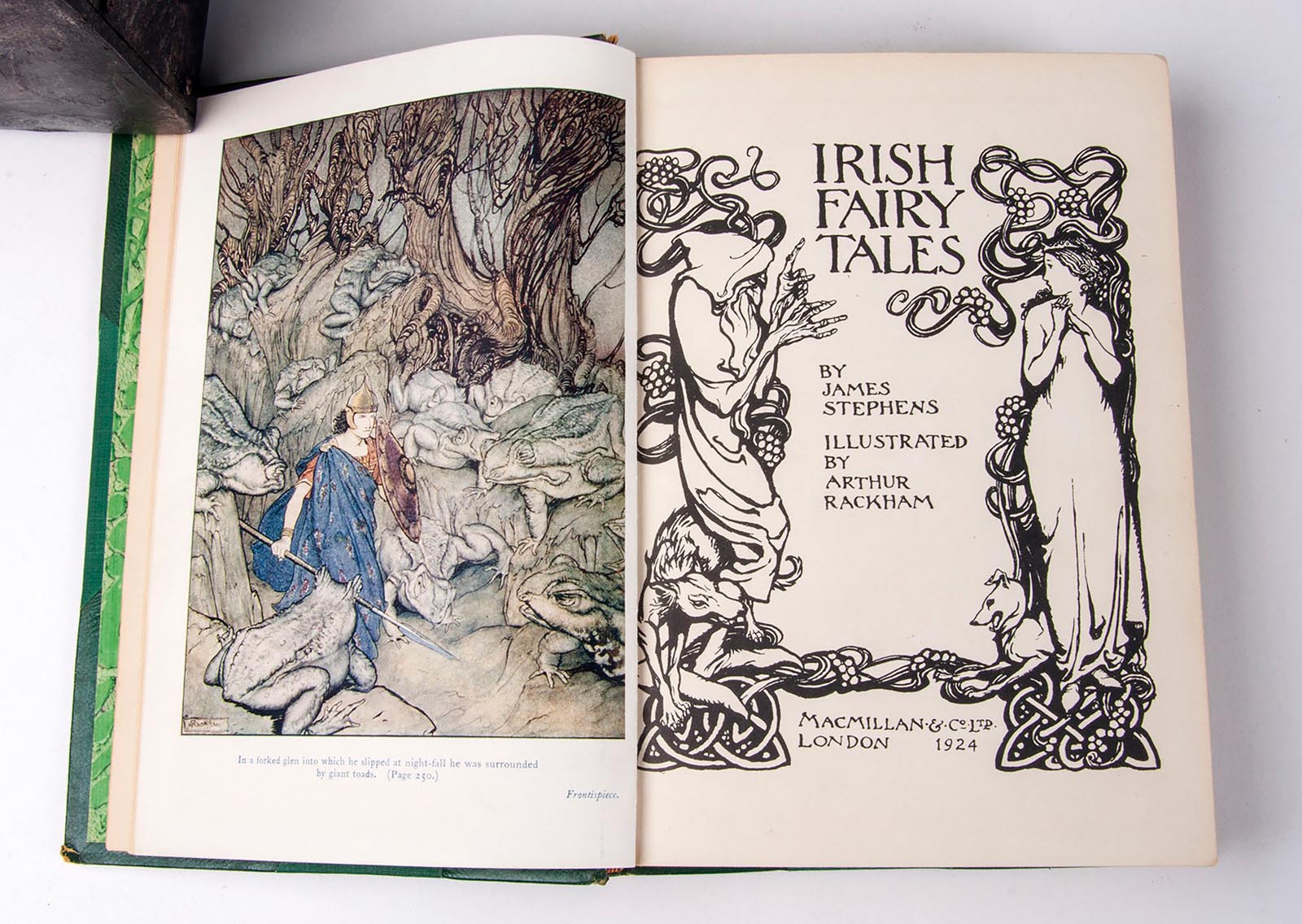 Photo of an illustration and title page in a book of Irish Fairy Ta.