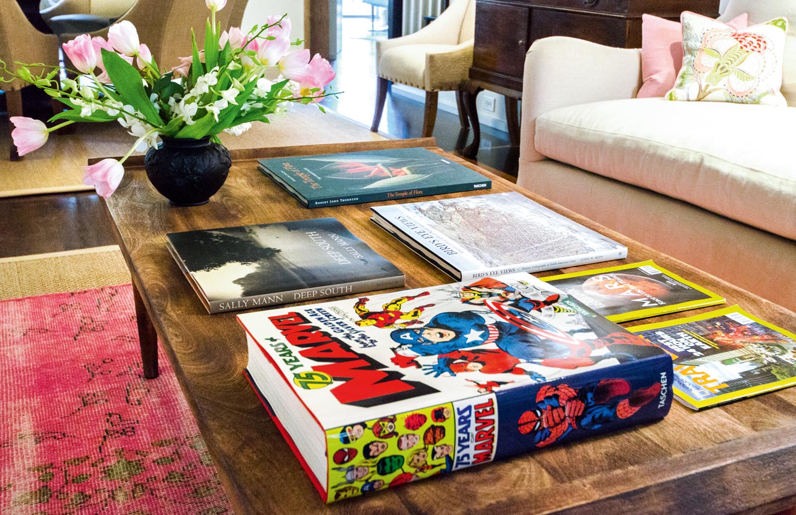 Photo of books placed face-up on a coffee table.