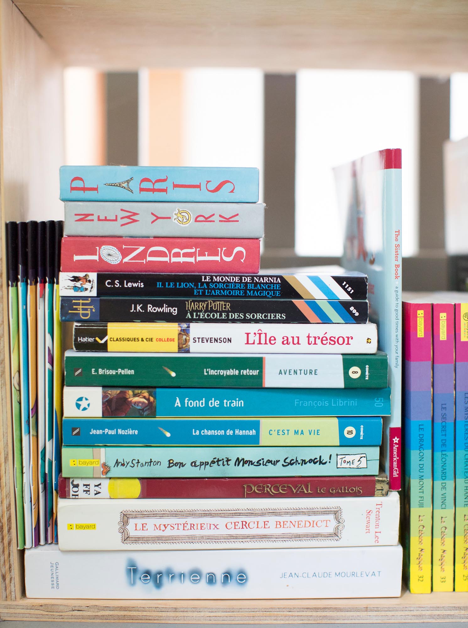 Photo of a stack of French ad city-themed board books.