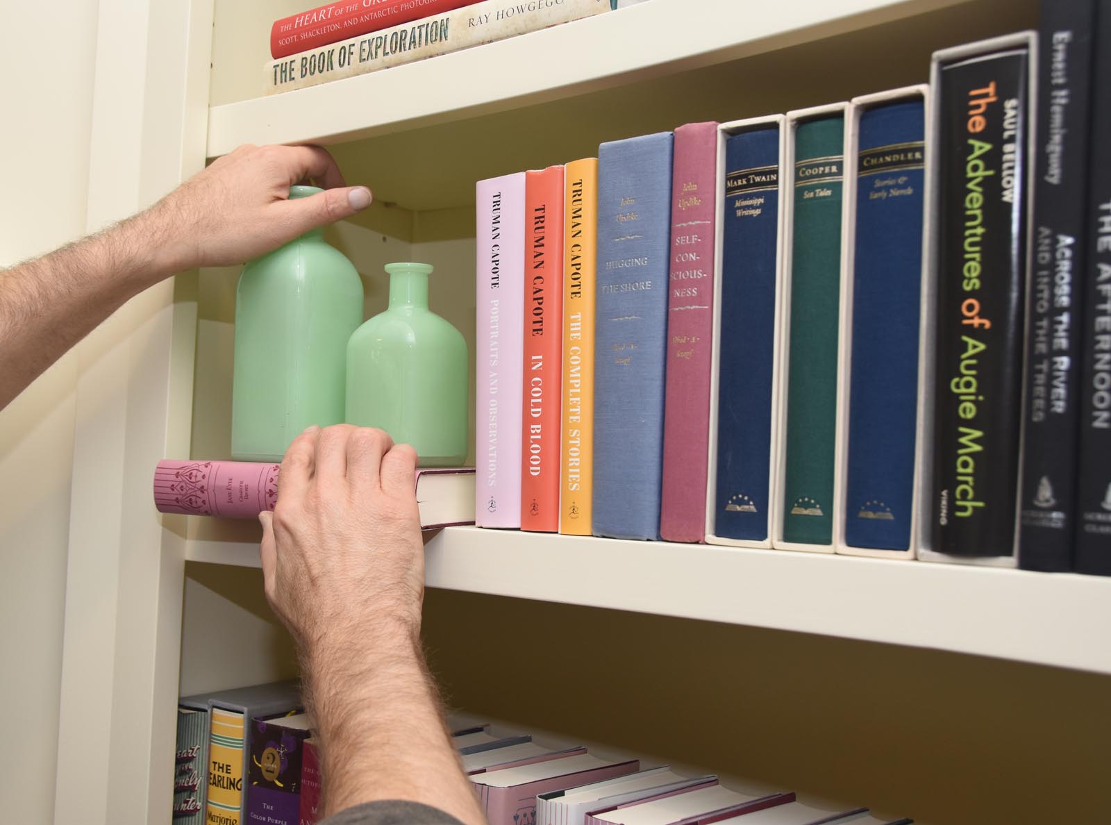 Photo of placing a horizontal book under the bottles.