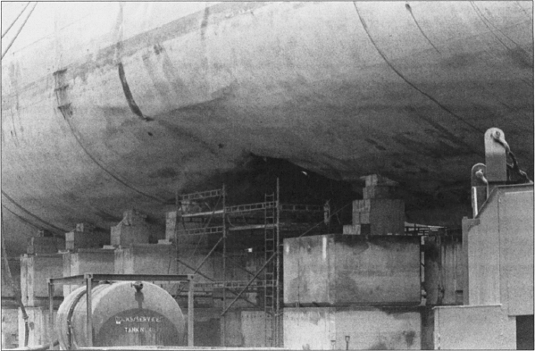 View of the Roberts’s hull breach from dry dock floor, 3 May 1988. Photographer’s Mate 2nd Class Rudy D. Pahoyo, U.S. Navy