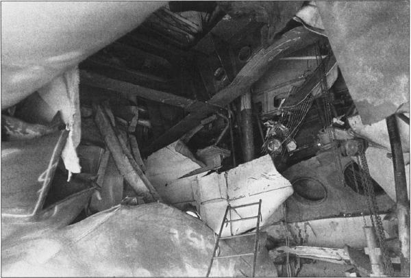 A look into the Roberts’s mangled main engine room from dry dock floor, 3 May 1988. Photographer’s Mate 2nd Class Rudy D. Pahoyo, U.S. Navy