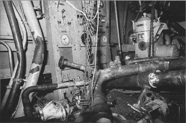 The damaged interior of Auxiliary Machine Room 3, 3 May 1988. Photographer’s Mate 2nd Class Rudy D. Pahoyo, U.S. Navy