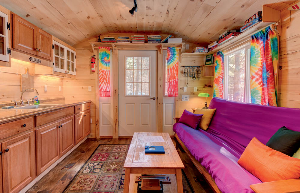 The interior living space and kitchen in the Apple Blossom Cottage.