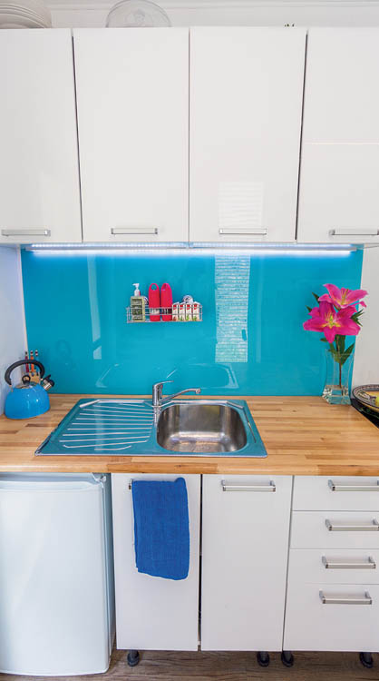 The kitchen area in the IQ Container tiny house.