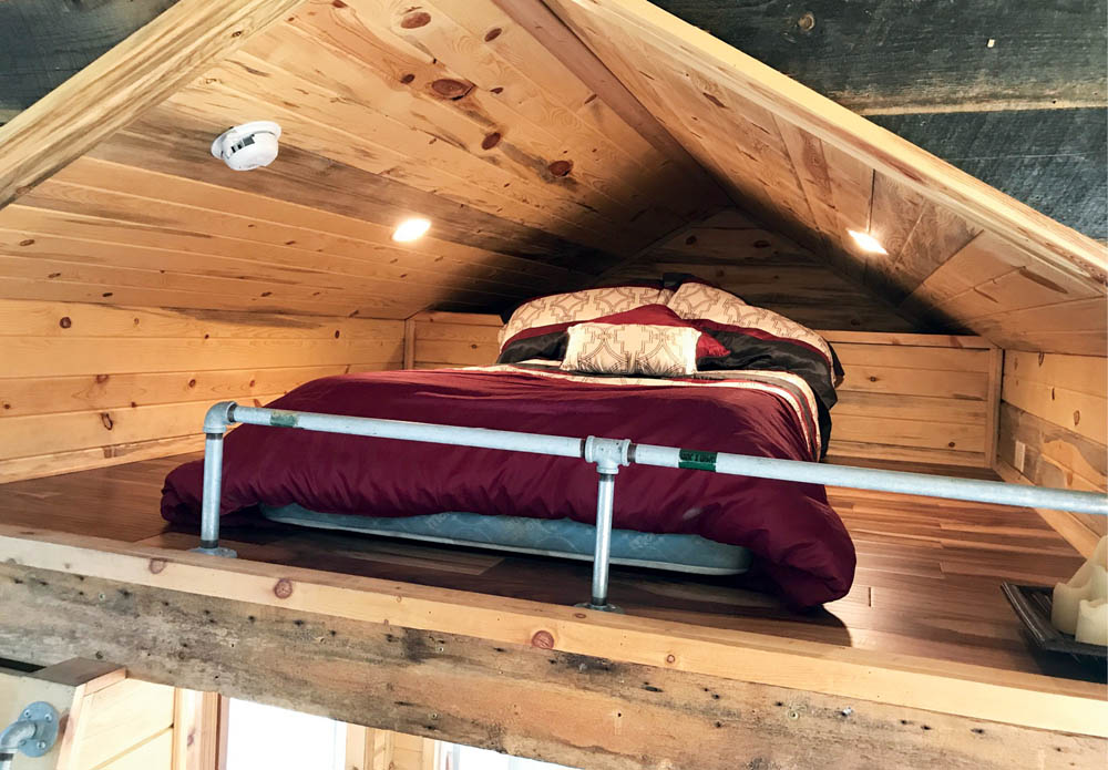 The sleeping loft in the Bunkaboose tiny house.