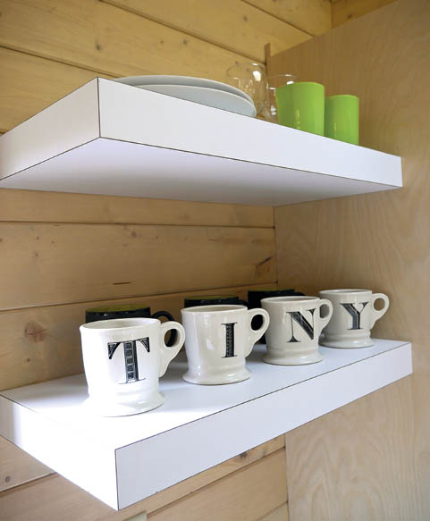 Shevling in the kitchen area in Dragonfly Tiny House.