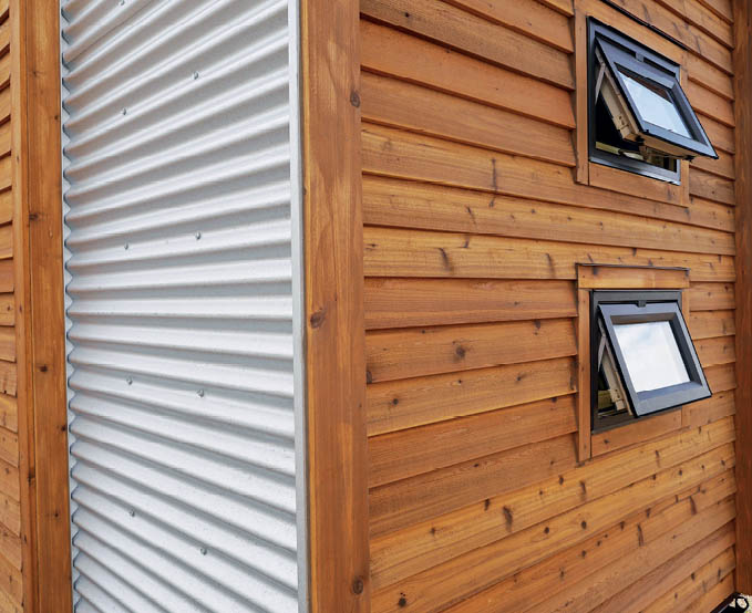 Metal and wood siding on the Dragonfly Tiny House.