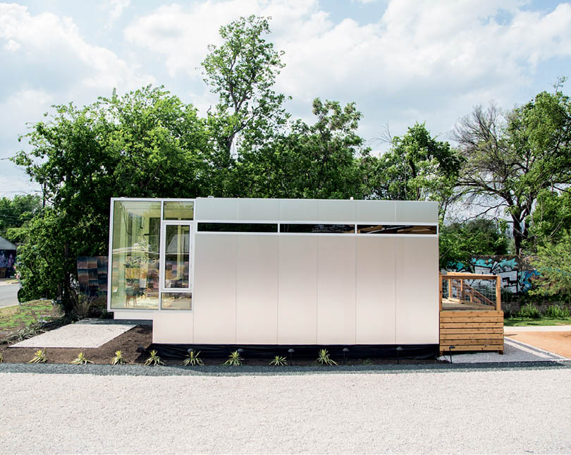 The outside of the Kasita tiny house, with an attached porch.