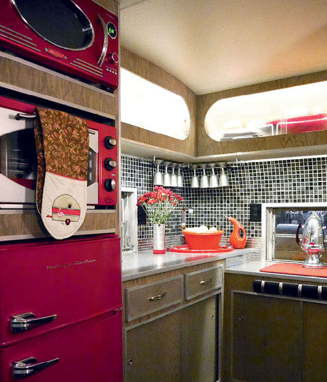 The interior kitchen space of the Kenney Camper.