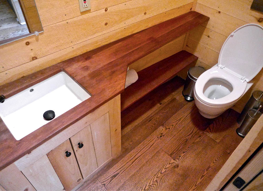 The bathroom in the Willow Tree House, with a sink and toilet.