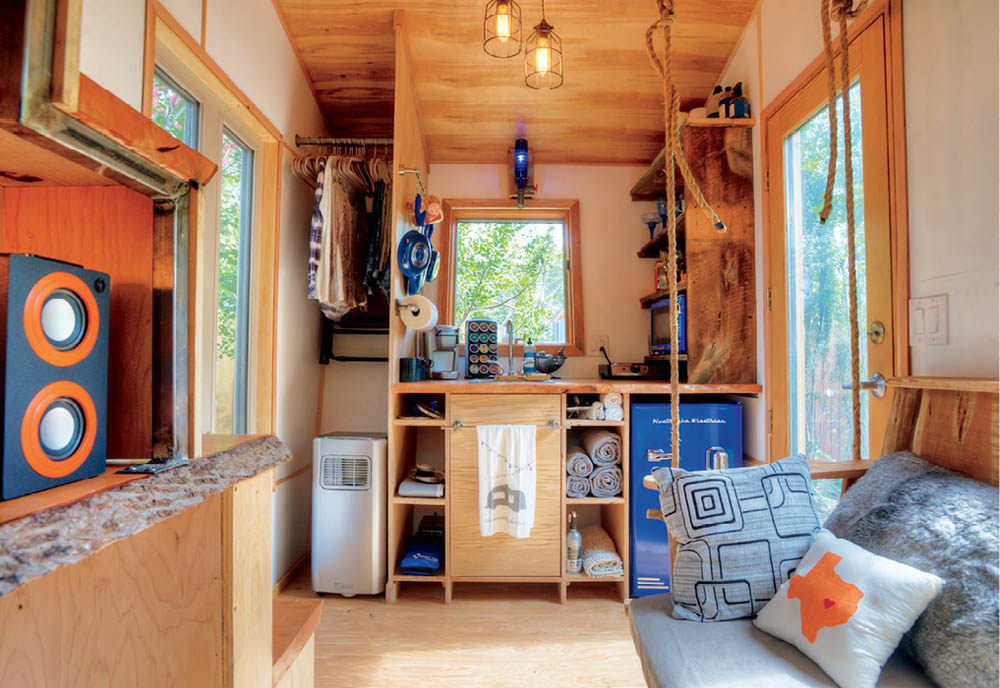 The interior kitchen and living space of a tiny home.