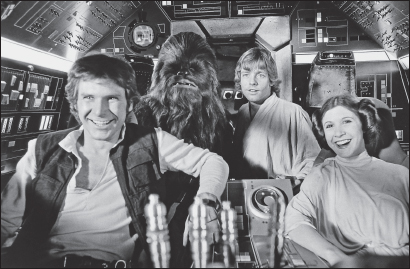 The bright, compelling cast that, according to Carrie Fisher, used to jokingly call itself “trick-talking meat”: Harrison Ford (Han Solo), Peter Mayhew (Chewbacca), Mark Hamill (Luke Skywalker), and Fisher (Princess Leia).