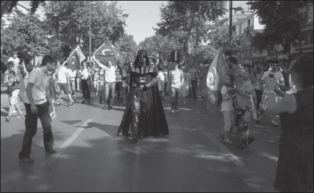 Eight years after narrowly escaping arrest for wearing a Darth Vader costume when the character was completely unknown, Turkish 501st Legion founder Ates Cetin finds himself leading a protest towards Taksim Square in 2013 while protesters hum the Imperial March.