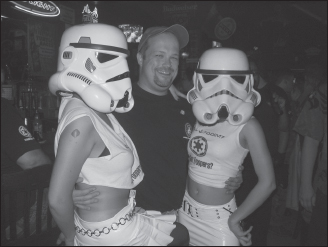 Albin Johnson, founder of the 501st Legion, is a shy, retiring, behind-the-scenes kind of guy—not that you’d know it from this rare shot of Albin with a couple of what he calls “Trooper Groupies.”