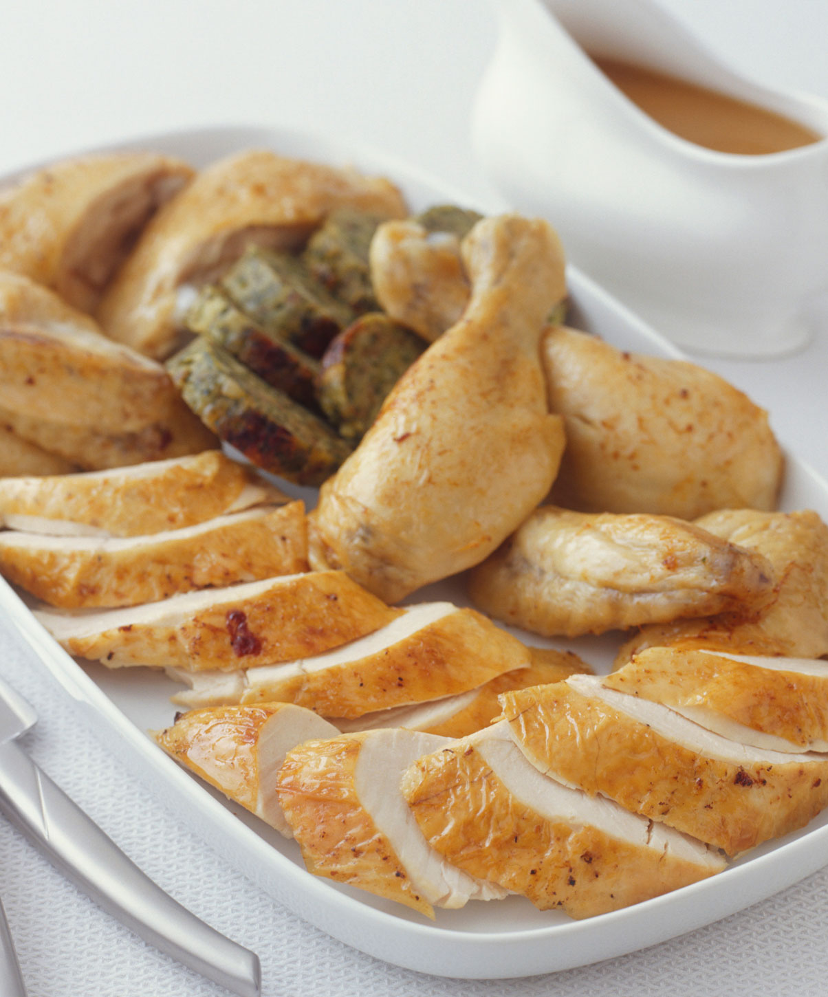 Roast chicken carved on a platter.