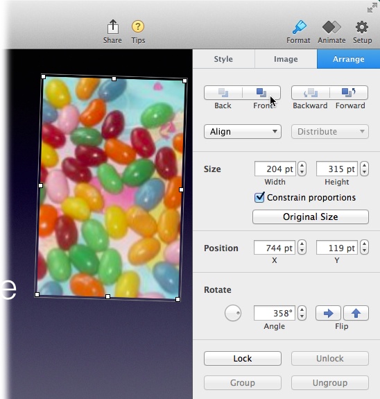 Arrange objects on a slide by dragging them into position. Because Keynote puts each object on its own layer, the objects stack on top of each other like a scrapbook. You can change the stacking order of these layers using the buttons at the top of Arrange tab. For more on organizing object layers, see page 187.