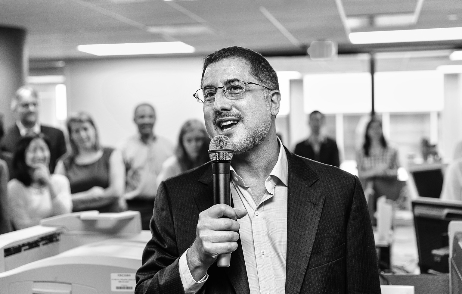 After the Pulitzer Prize for Public Service was awarded to The Washington Post, reporters and editors gather in the newsroom in Washington, Monday, April 14, 2014, as contributing writer Barton Gellman describes the effort that went into a series of stories on the government’s massive surveillance program based on information leaked by National Security Agency employee Edward Snowden. The disclosures showed that the NSA has collected information about millions of Americans’ phone calls and emails based on its classified interpretations of laws passed after the 2001 terrorist attacks. The Pulitzer Prizes, journalism’s highest honor, are given out each year by Columbia University on the recommendation of a board of journalists and others. This is Gellman’s third Pulitzer honor. (AP Photo/J. Scott Applewhite)