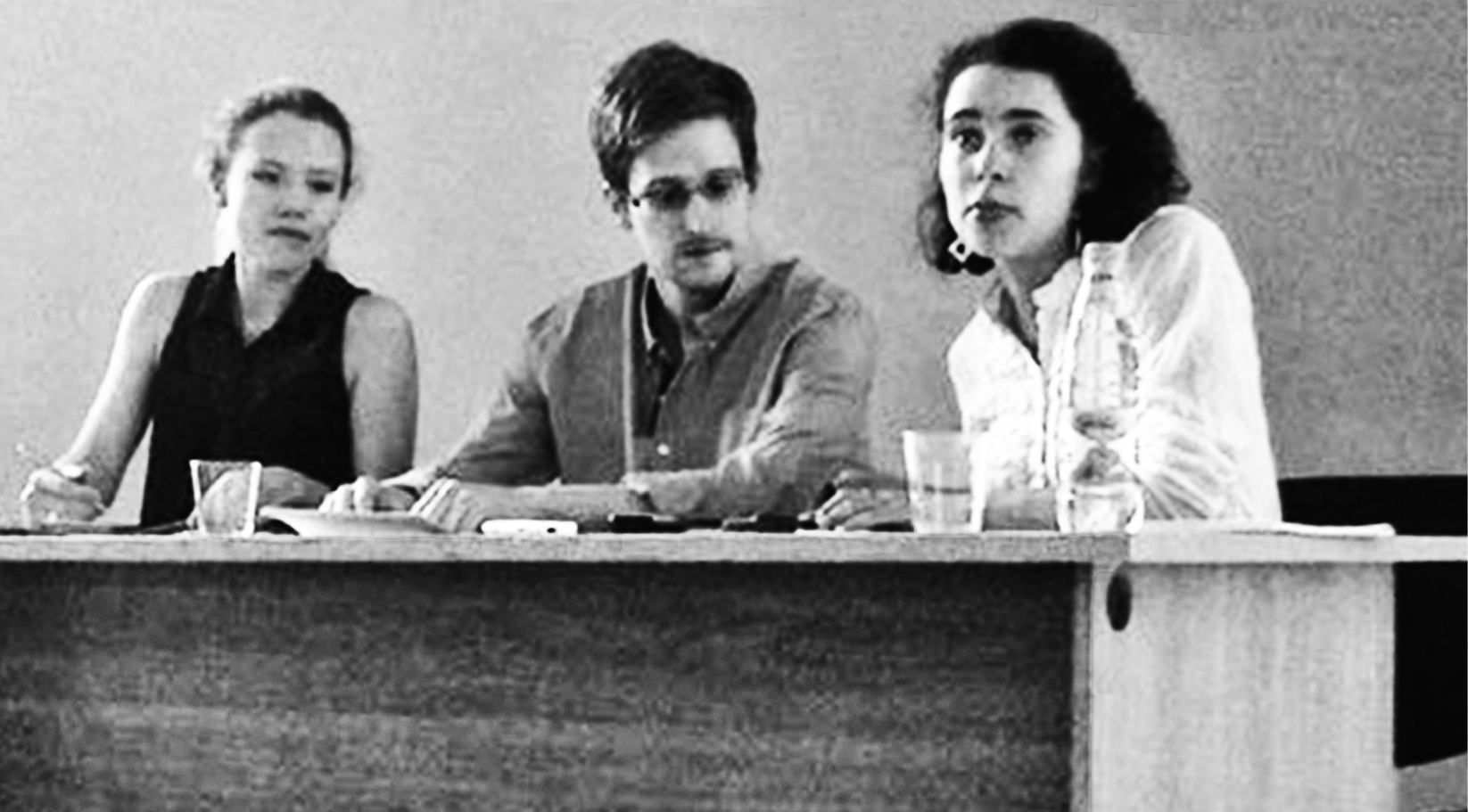 Snowden’s first appearance in Russia was in a cordoned-off lounge at the Moscow airport on July 12, 2013. Seated to his right is Sarah Harrison, the “ninja” Assange had sent to Hong Kong to help him get to Russia; a government-supplied translator is on his left. No press was allowed into this Russian-style “press conference.” Snowden officially requested asylum.