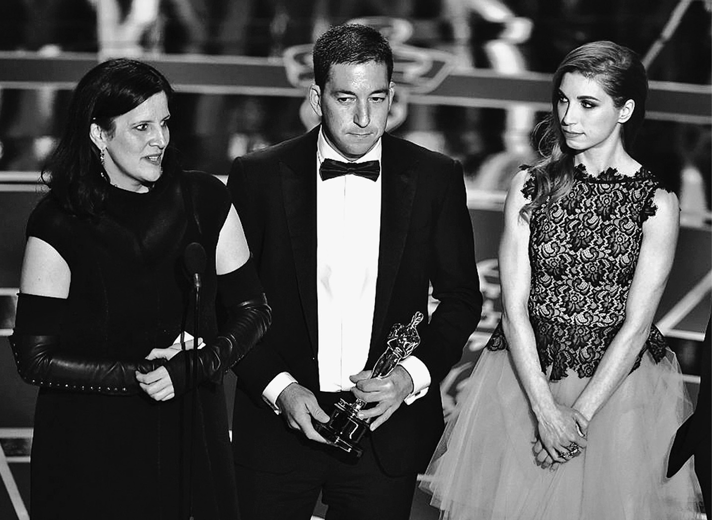 HOLLYWOOD, CA - FEBRUARY 22:  (L-R) Director Laura Poitras, journalist Glenn Greenwald, and Lindsay Mills accept Best Documentary Feature for 'Citizenfour' onstage during the 87th Annual Academy Awards at Dolby Theatre on February 22, 2015 in Hollywood, California.  (Photo by Kevin Winter/Getty Images)